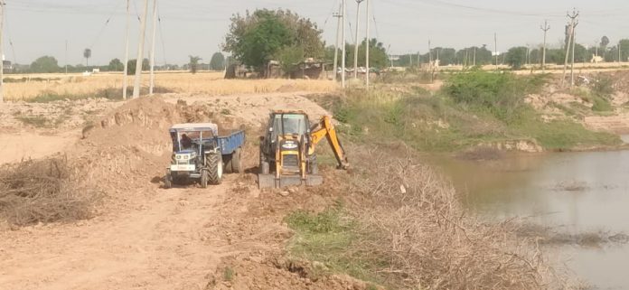 Matter Of Digging Soil Out Of Pond